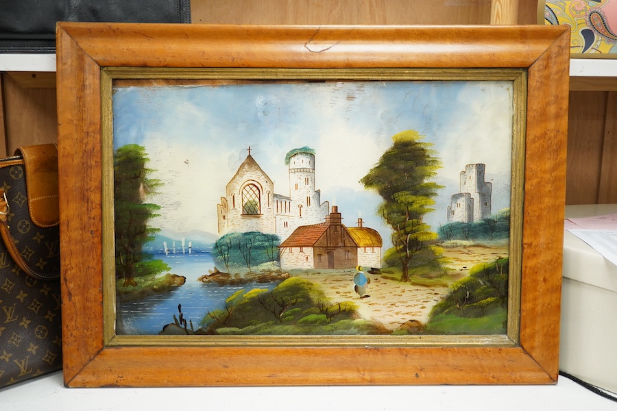 A large Victorian reverse glass picture of a castle and abbey ruins beside a river, 37 x 56cm, maple framed. Condition - fair